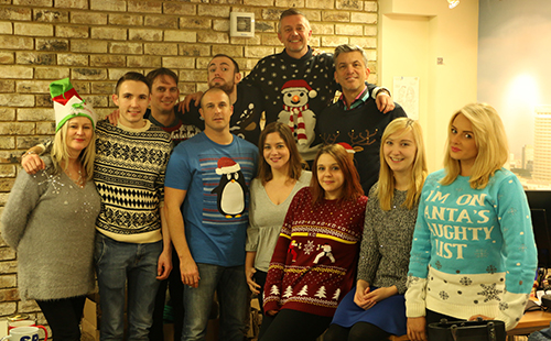 working offcie havinggroup photo done for christmas