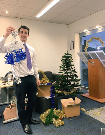 business man setting up his office for christmas