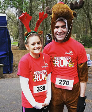sponsored run with 2 people dressed up for christmas