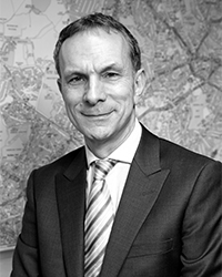 black white photo of man in a suit 